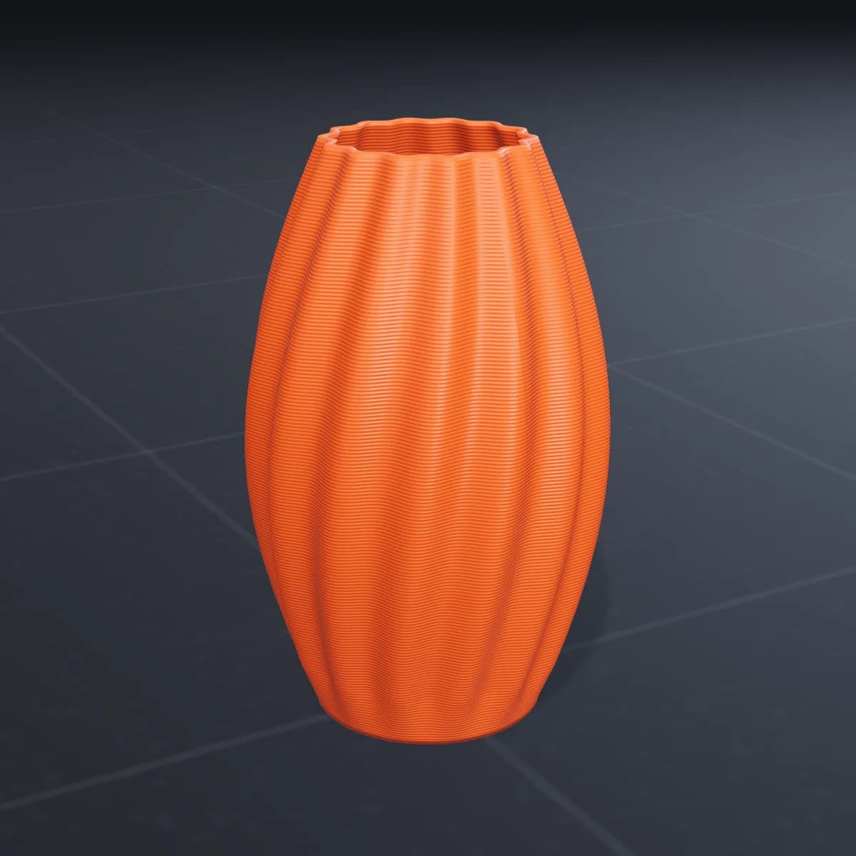 Vaso laranja impresso em 3D sobre a mesa da impressora